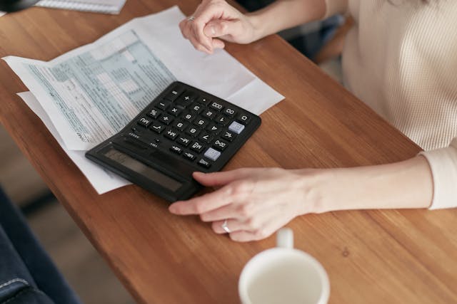 person calculating their bills