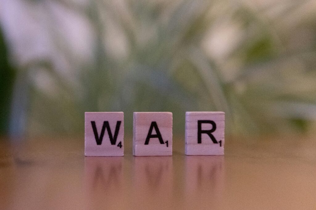 scrabble tiles of the word war